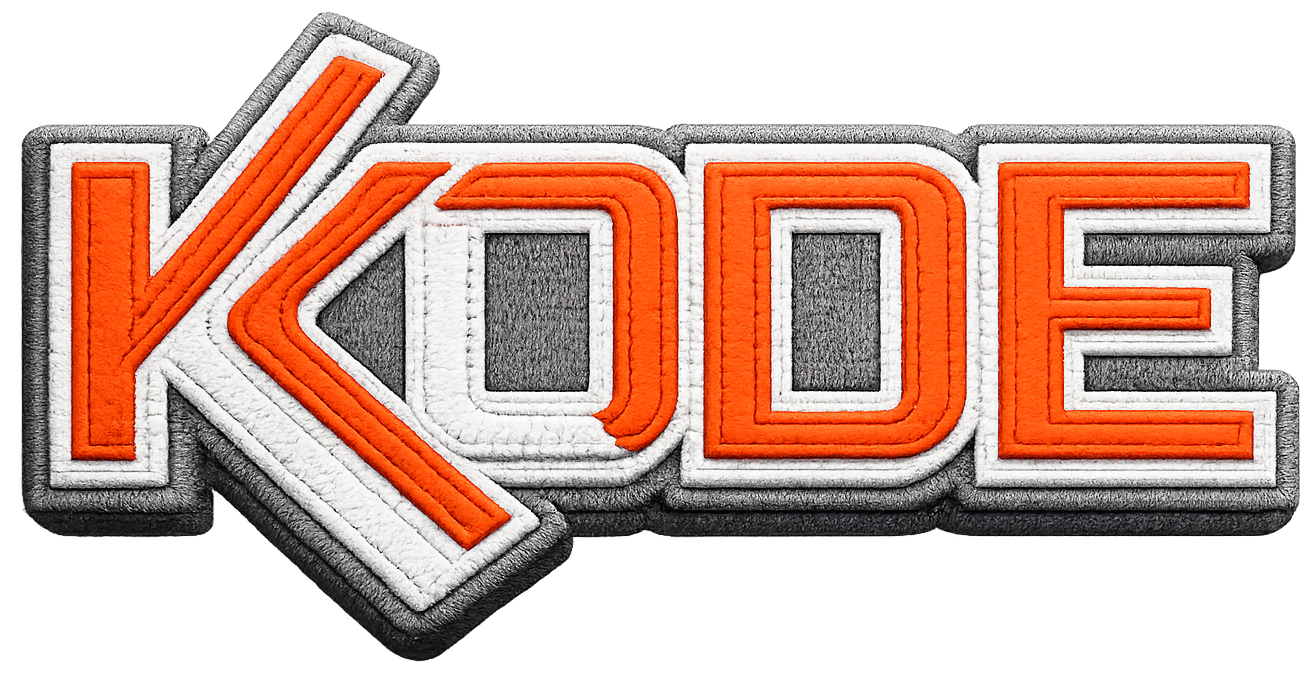 An embroidered appliqué KODE patch — one of the decorated products Kode supplies