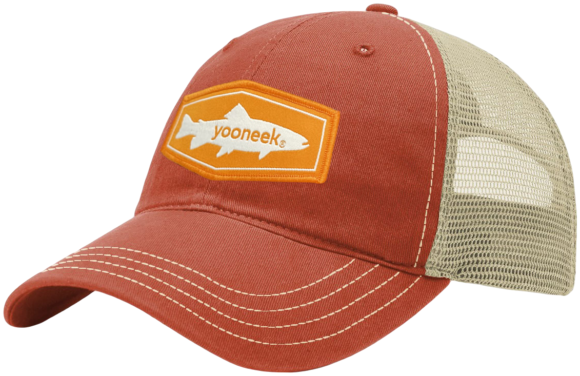 Trucker cap with a woven patch applied to the front panel