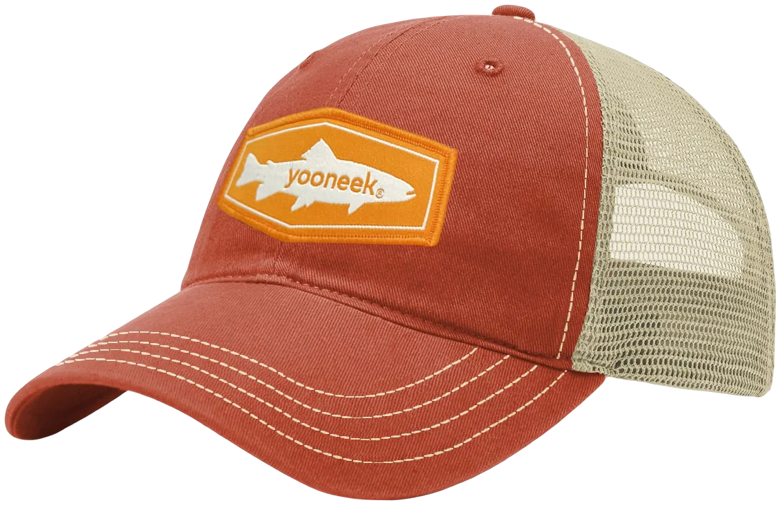 Trucker cap with a woven patch applied to the front panel