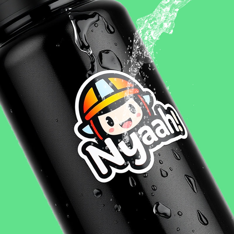 A die-cut UV sticker on a black bottle under running water, still bright and sealed