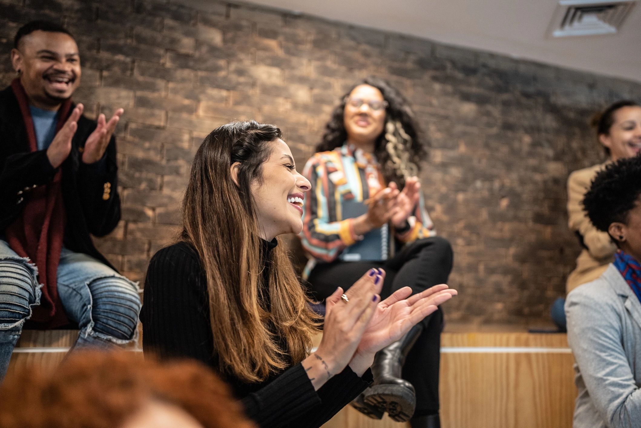 People clapping in a seminar